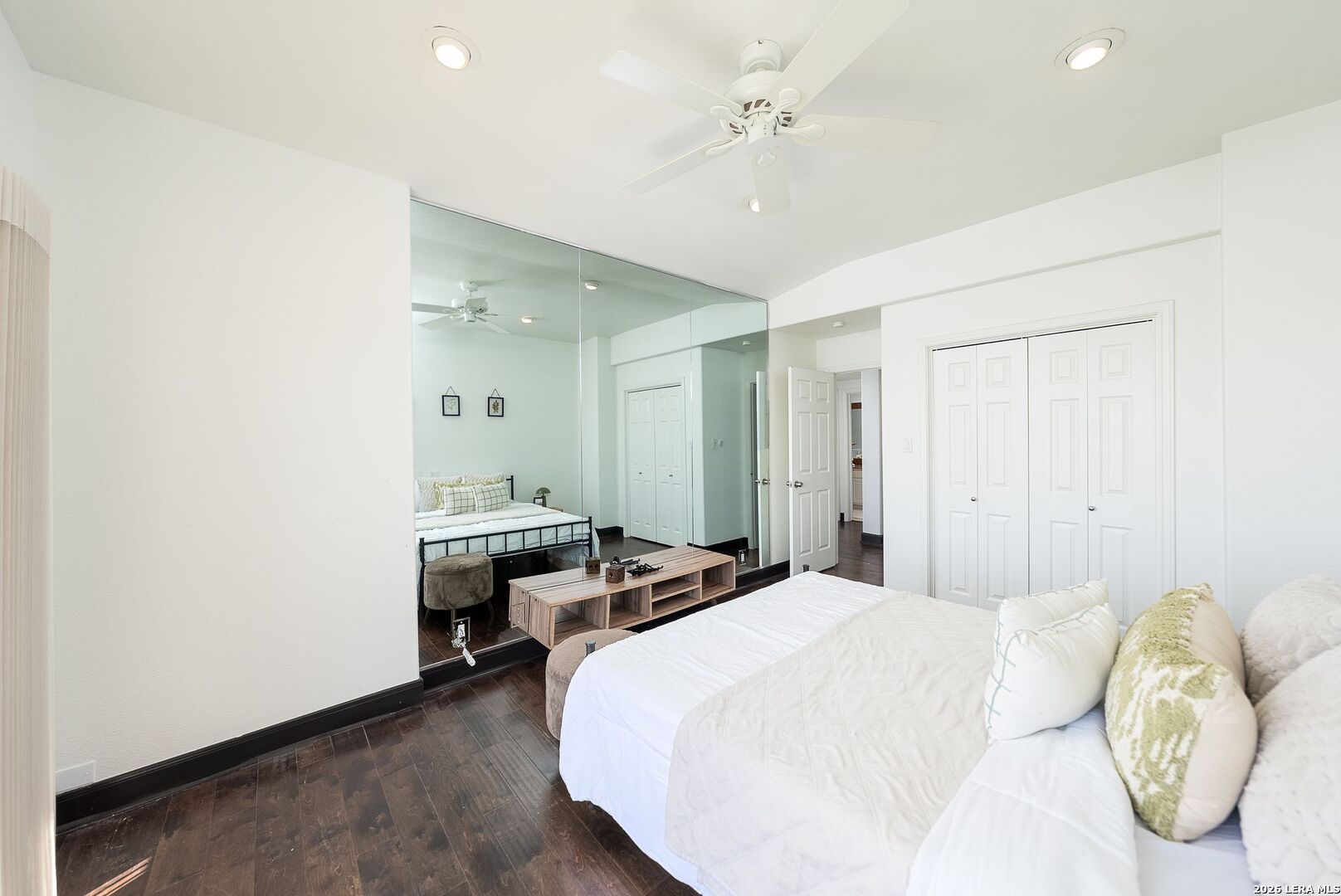 7701 Wurzbach Road, Unit 2302 San Antonio, TX 78229 - Photo 22 of 49 a bedroom with a bed and a chandelier