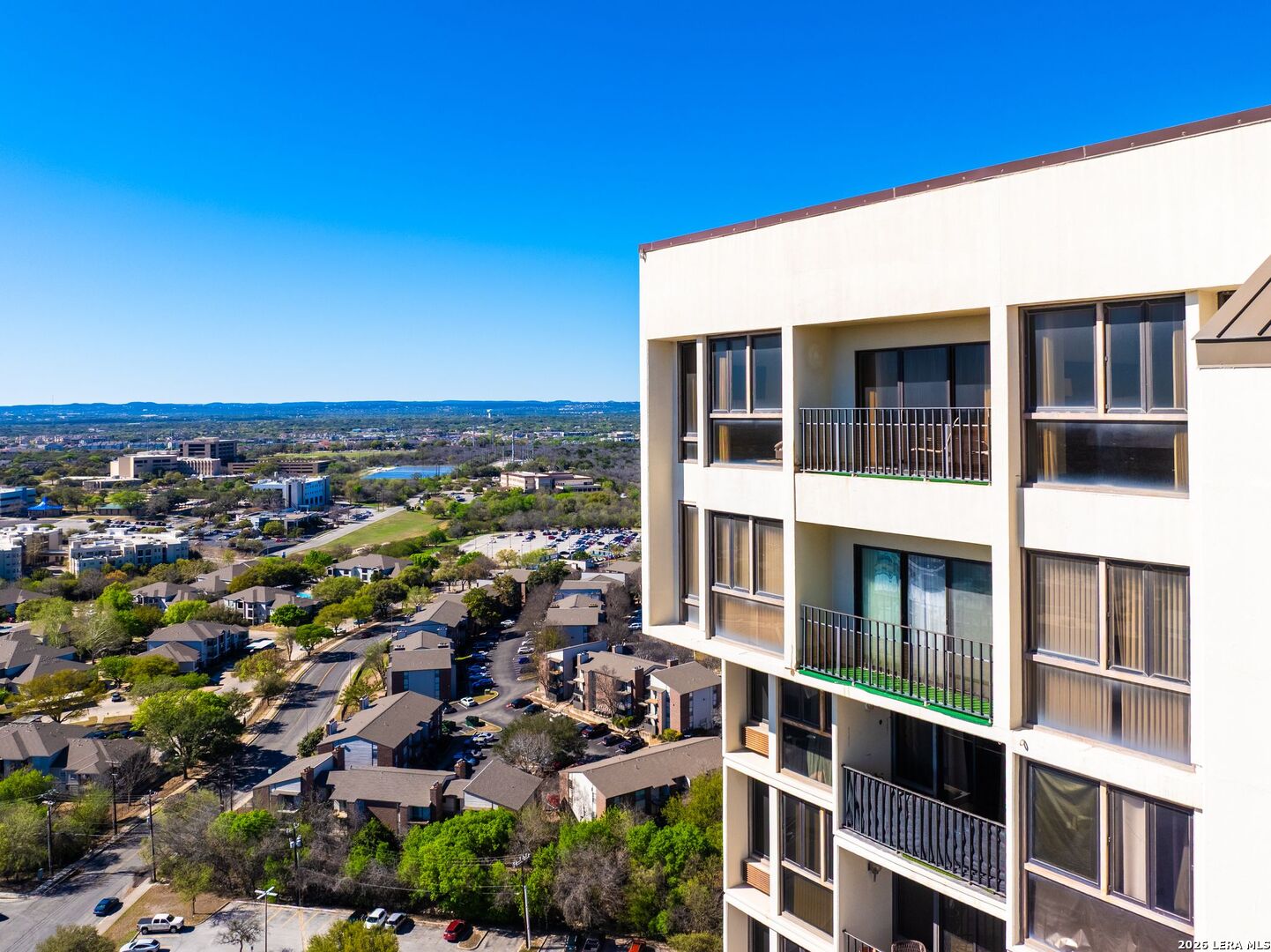 7701 Wurzbach Road, Unit 2302 San Antonio, TX 78229 - Photo 28 of 49 a view of building with an outdoor space