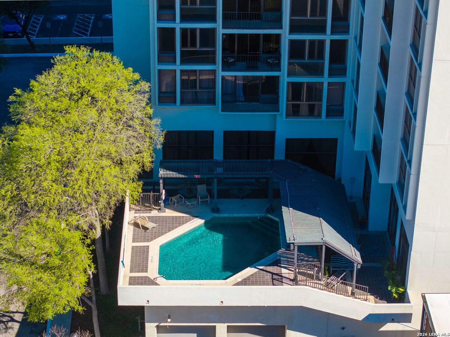 7701 Wurzbach Road, Unit 2302 San Antonio, TX 78229 - Photo 31 of 49 a balcony with table and chairs