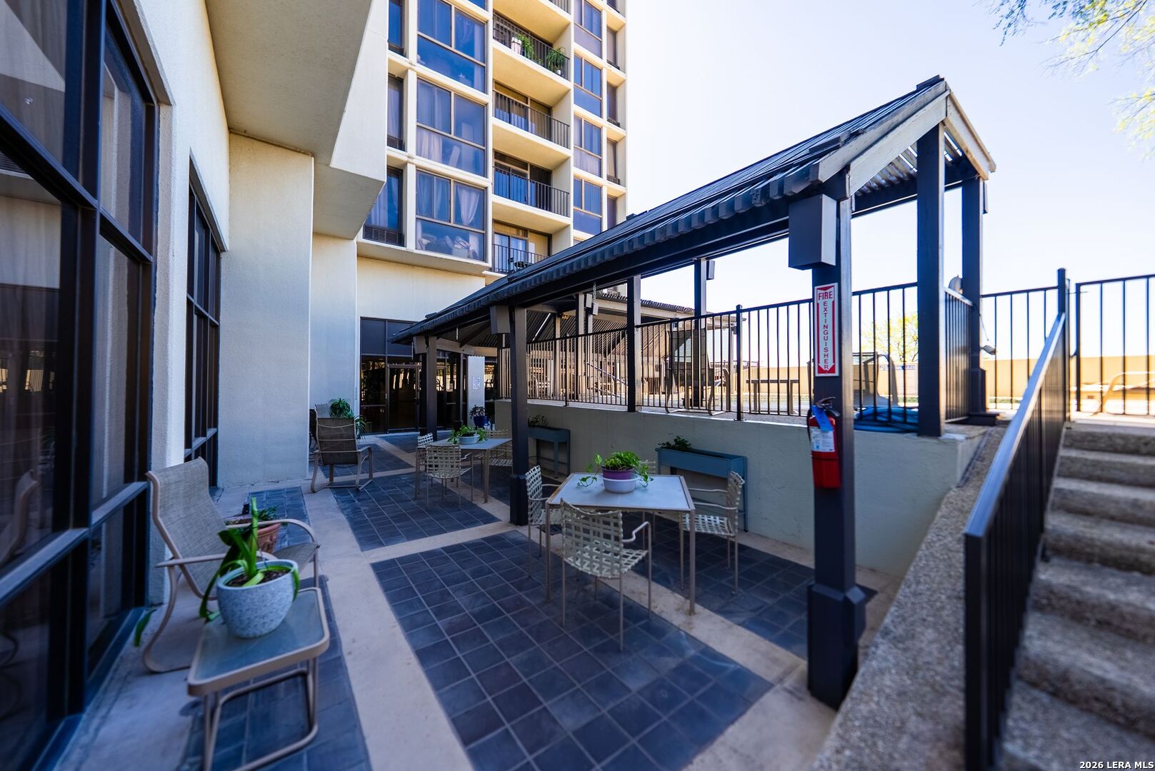 7701 Wurzbach Road, Unit 2302 San Antonio, TX 78229 - Photo 36 of 49 a view of an chairs and tables in the balcony