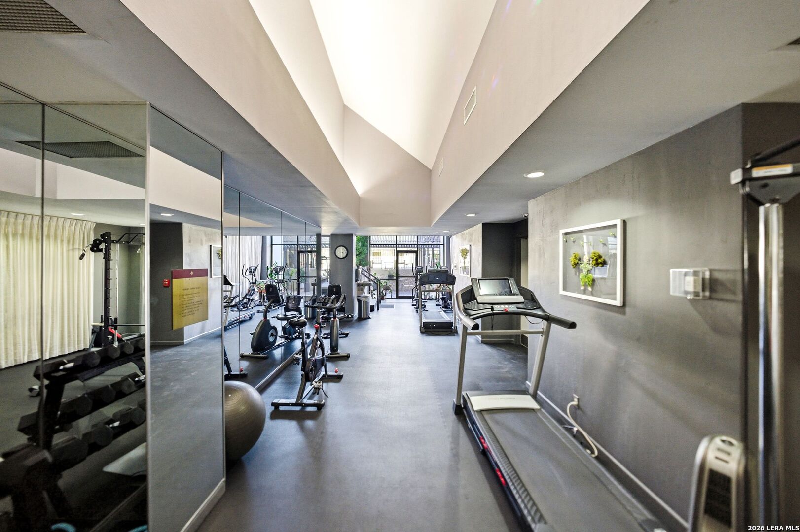 7701 Wurzbach Road, Unit 2302 San Antonio, TX 78229 - Photo 38 of 49 a view of a room with gym equipment