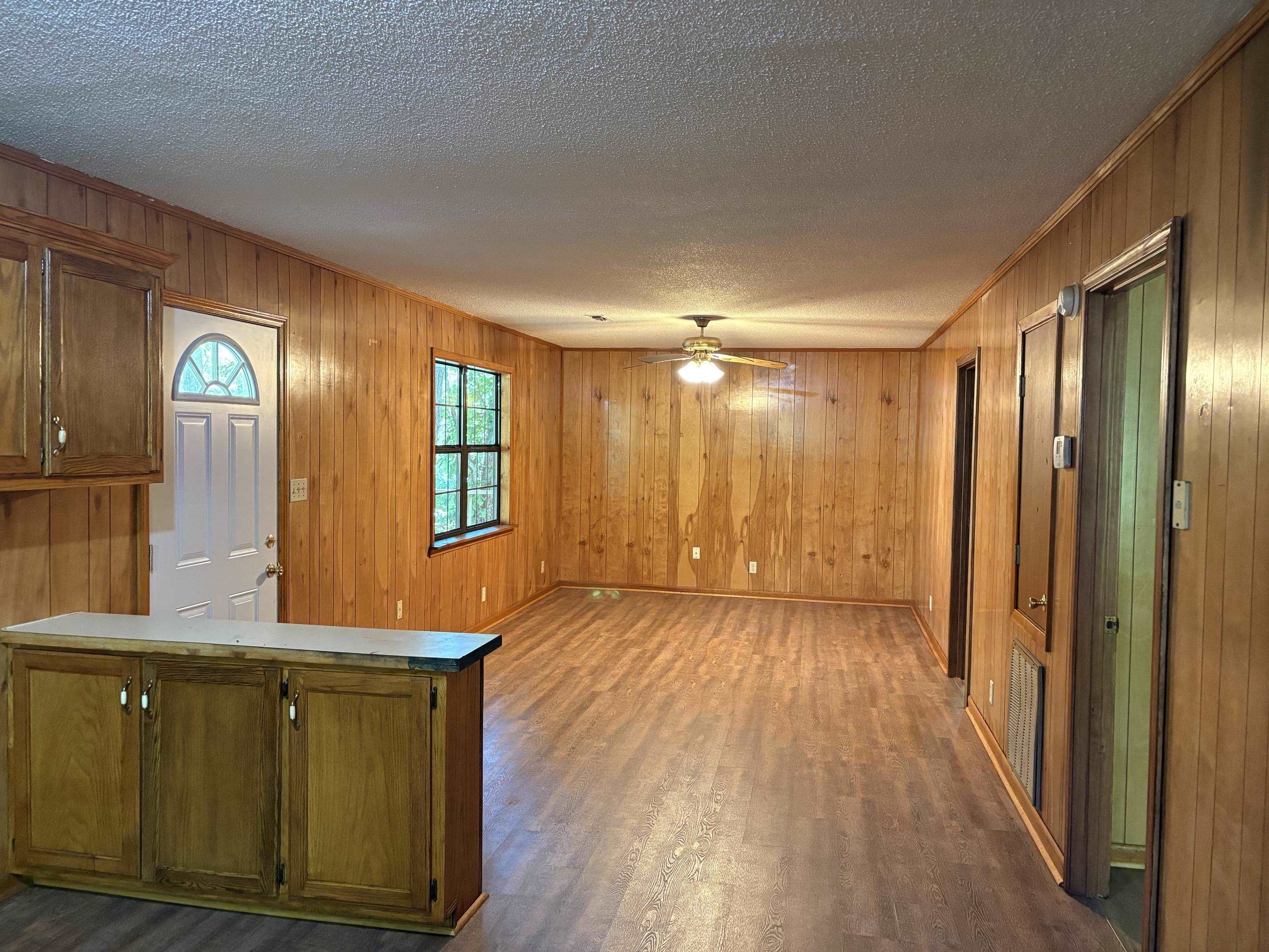 146 Walker Street Ripley, TN 38063 - Photo 7 of 14 a view of hallway with windows and wooden floor