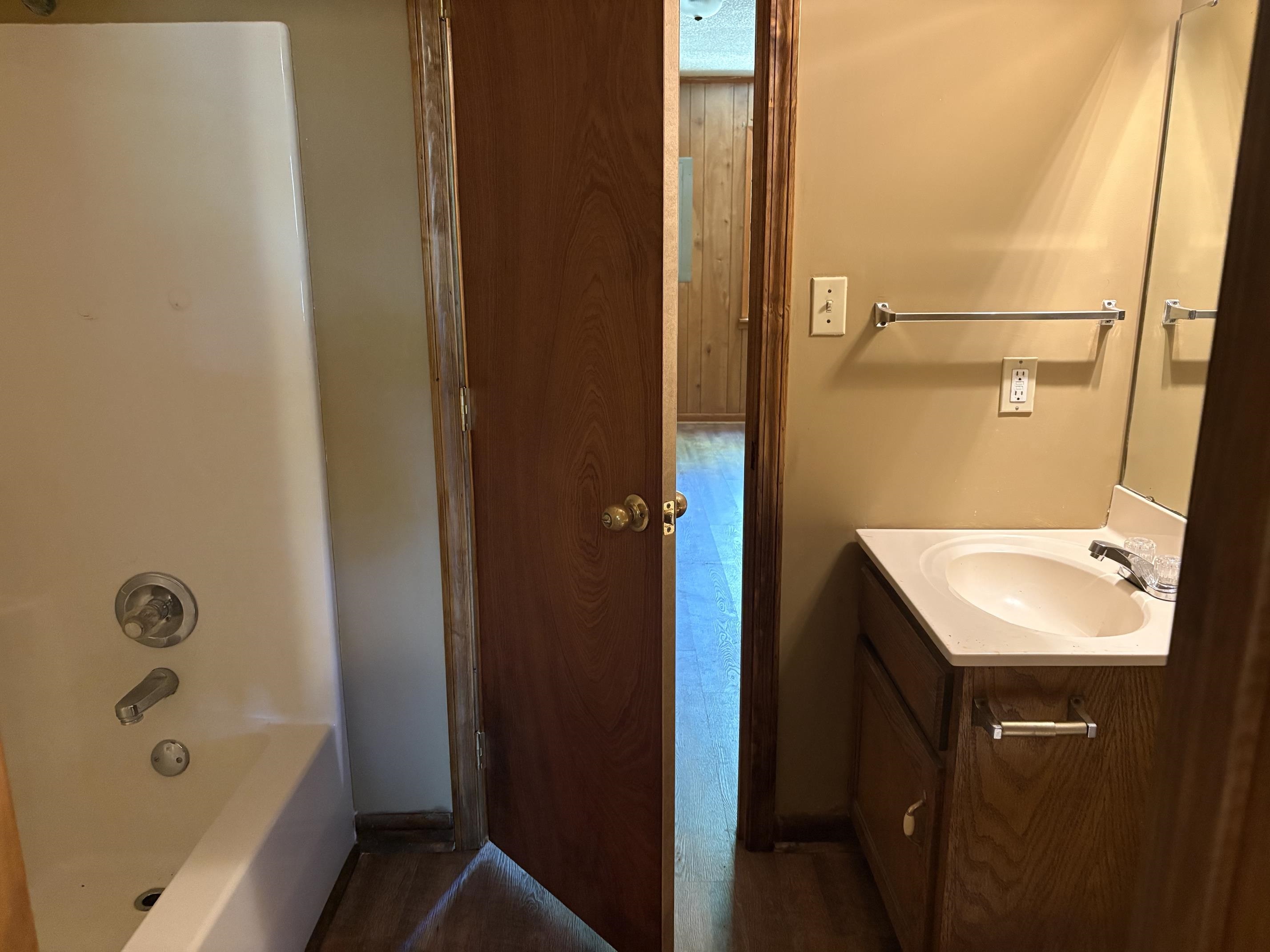 146 Walker Street Ripley, TN 38063 - Photo 9 of 14 a bathroom with a sink a toilet and shower