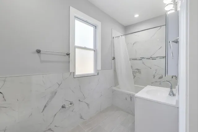 a bathroom with a sink and a shower