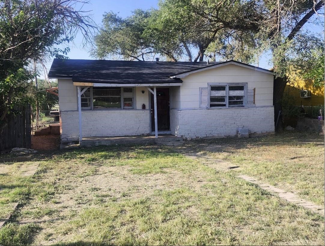 1503 East 8th Street Lubbock, TX 79403 - Photo 1 of 12 a front view of a house with garden