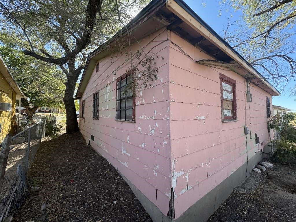 1503 East 8th Street Lubbock, TX 79403 - Photo 3 of 12 a view of a house with a yard