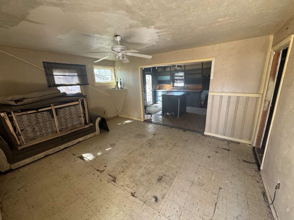 1503 East 8th Street Lubbock, TX 79403 - Photo 5 of 12 a living room with furniture and a flat screen tv