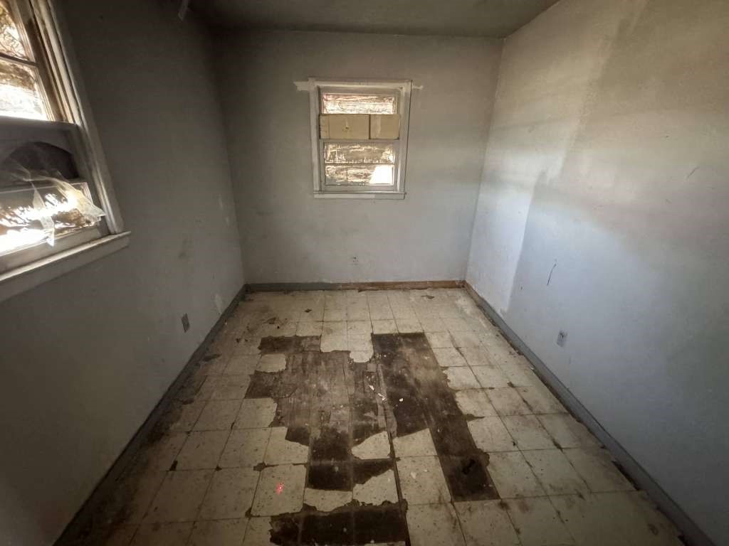 1503 East 8th Street Lubbock, TX 79403 - Photo 9 of 12 an empty room with windows