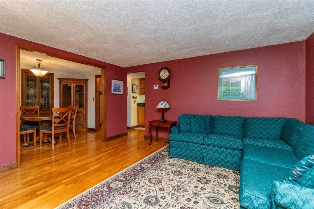 118 Bruce Road Walpole, MA 02081 - Photo 12 of 30 a living room with furniture and a dining area