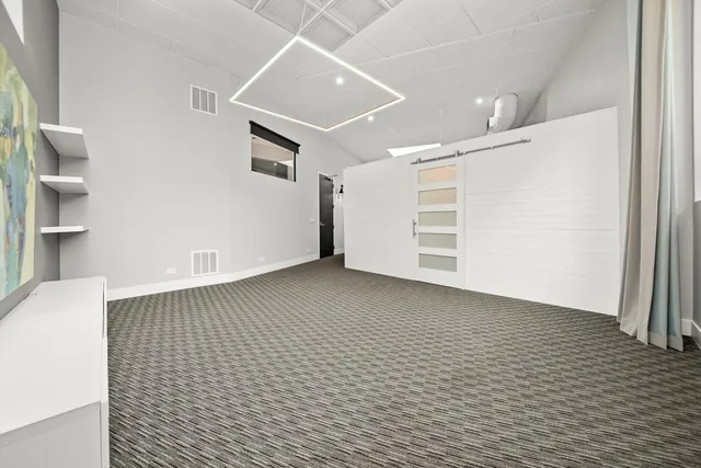 a view of an empty room with a window