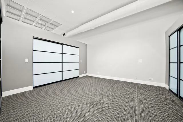 a view of a room with a wooden floor