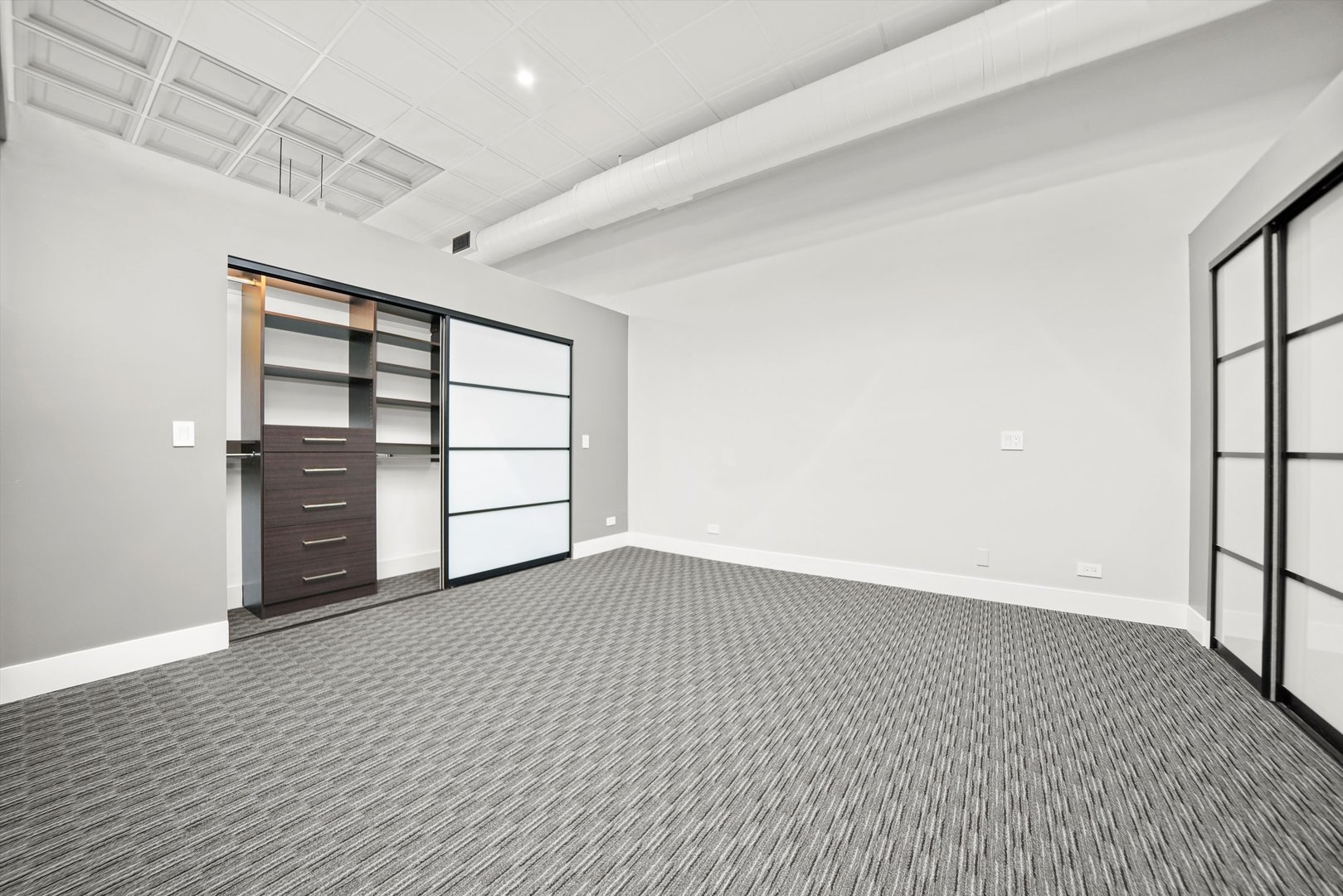 300 North Ogden Avenue, Unit 202 Chicago, IL 60607 - Photo 17 of 25 an empty room with a empty space and windows