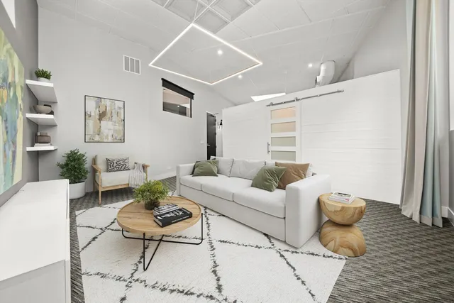 a living room with furniture and a table