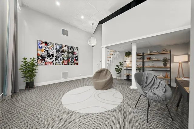 a living room with furniture and white walls