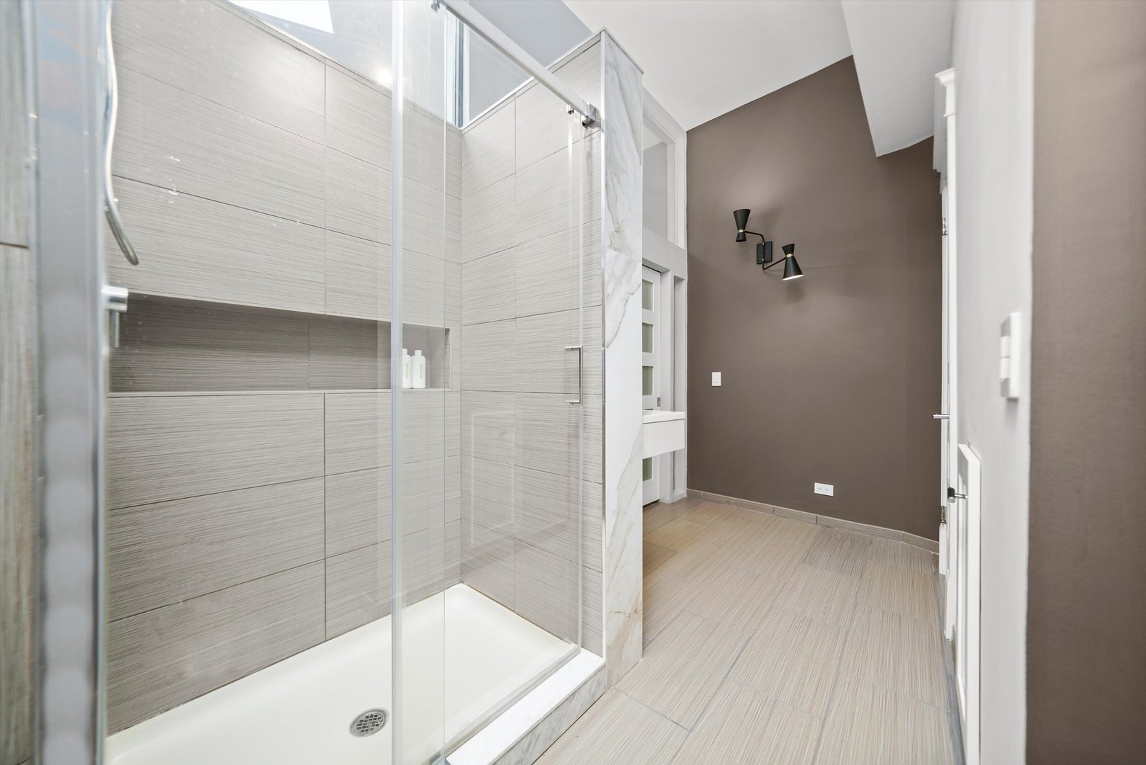 300 North Ogden Avenue, Unit 202 Chicago, IL 60607 - Photo 10 of 25 a bathroom with a shower and a glass door