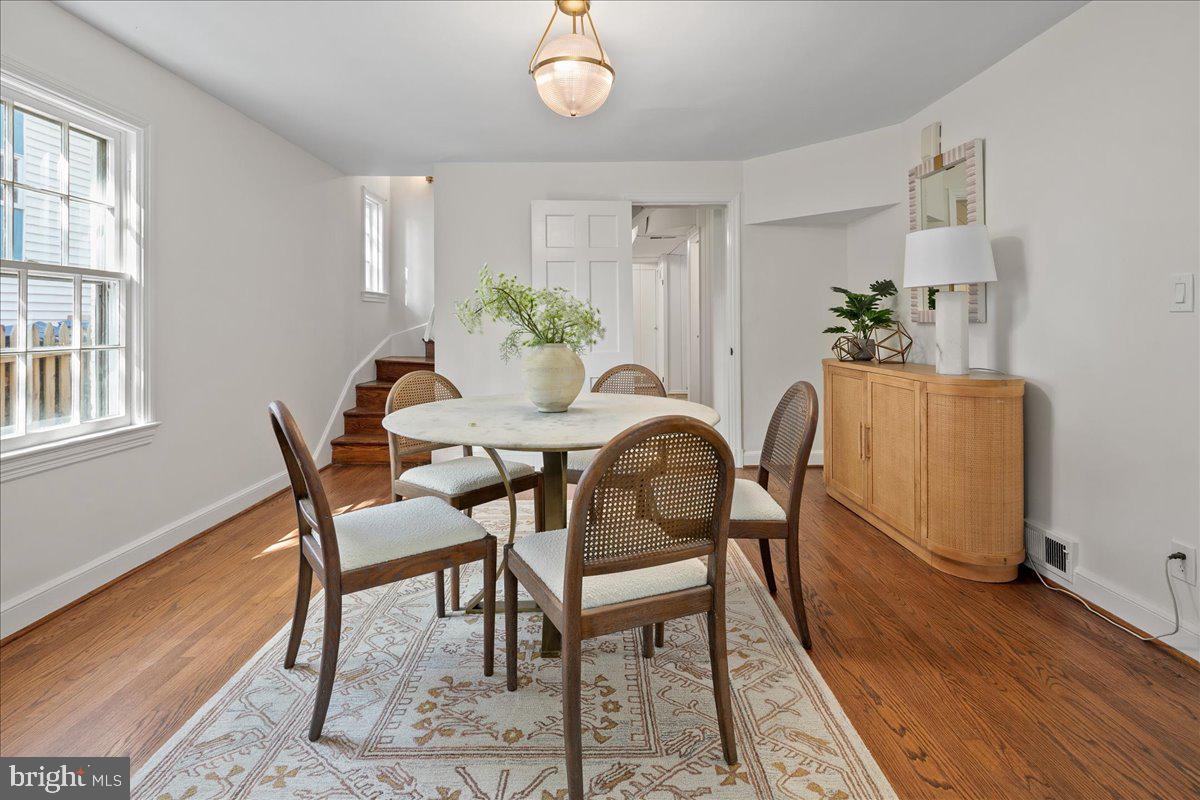 1606 North Springwood Drive Silver Spring, MD 20910 - Photo 14 of 36 a dining room with furniture potted plants and wooden floor