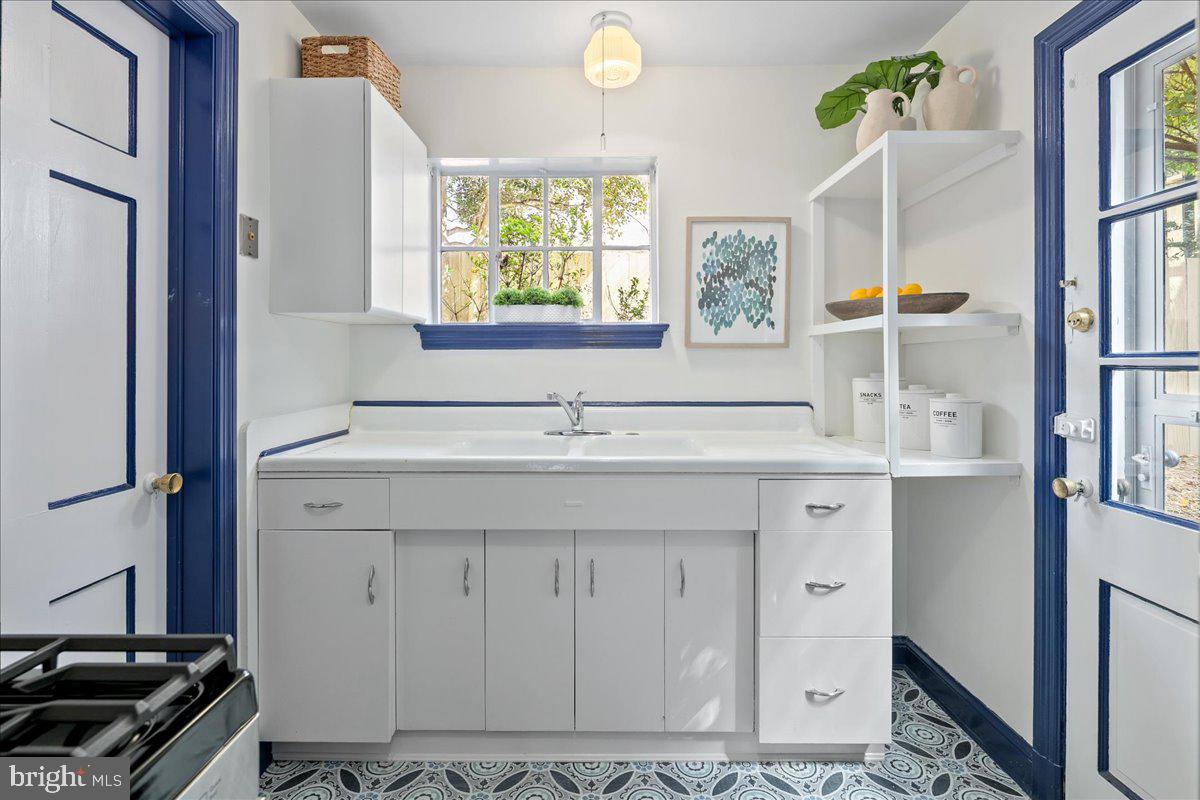 1606 North Springwood Drive Silver Spring, MD 20910 - Photo 16 of 36 a bathroom with a sink a vanity and a mirror