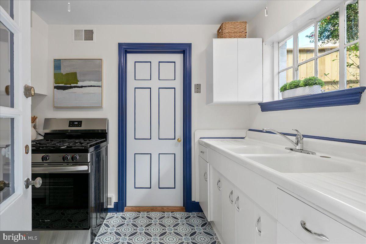 1606 North Springwood Drive Silver Spring, MD 20910 - Photo 20 of 36 a kitchen with a stove oven and sink