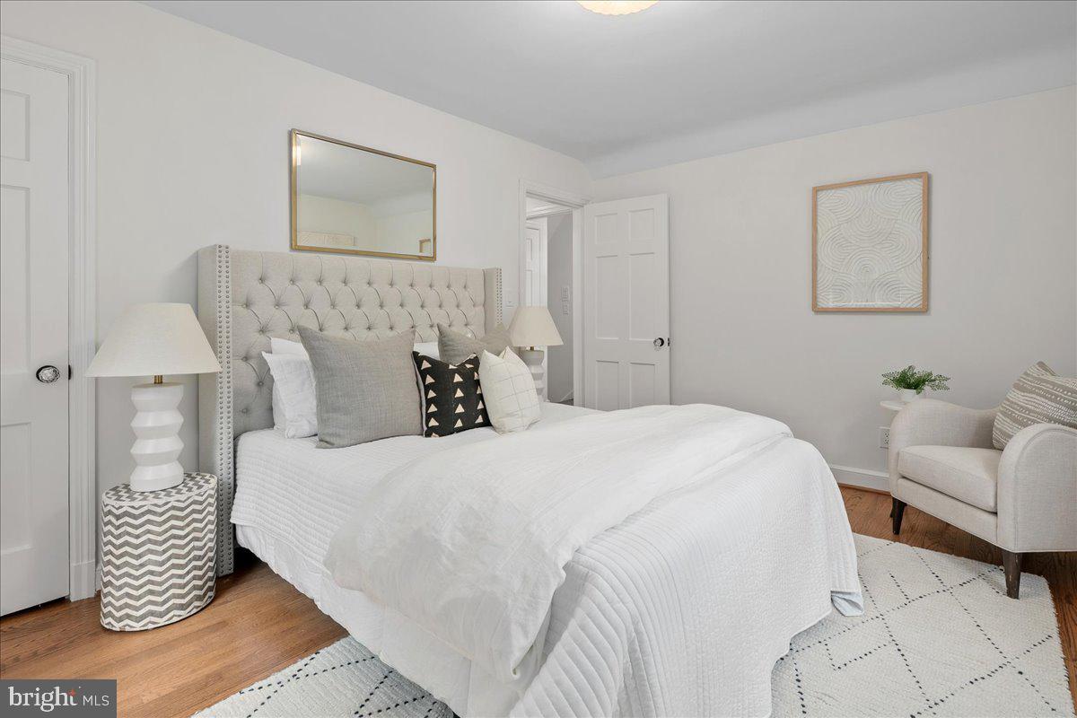 1606 North Springwood Drive Silver Spring, MD 20910 - Photo 23 of 36 a bedroom with a white bed and a couch