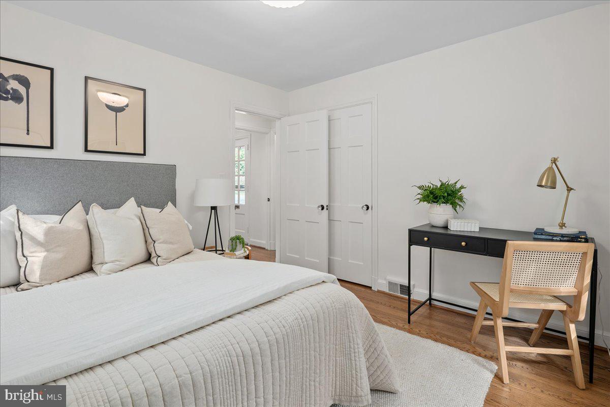 1606 North Springwood Drive Silver Spring, MD 20910 - Photo 24 of 36 a bedroom with a bed and chair