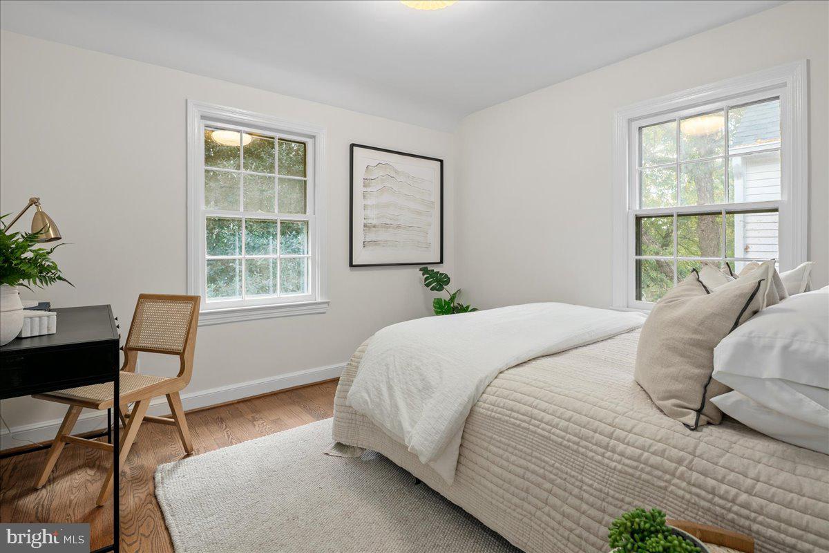 1606 North Springwood Drive Silver Spring, MD 20910 - Photo 25 of 36 a bedroom with a bed table chair and a window