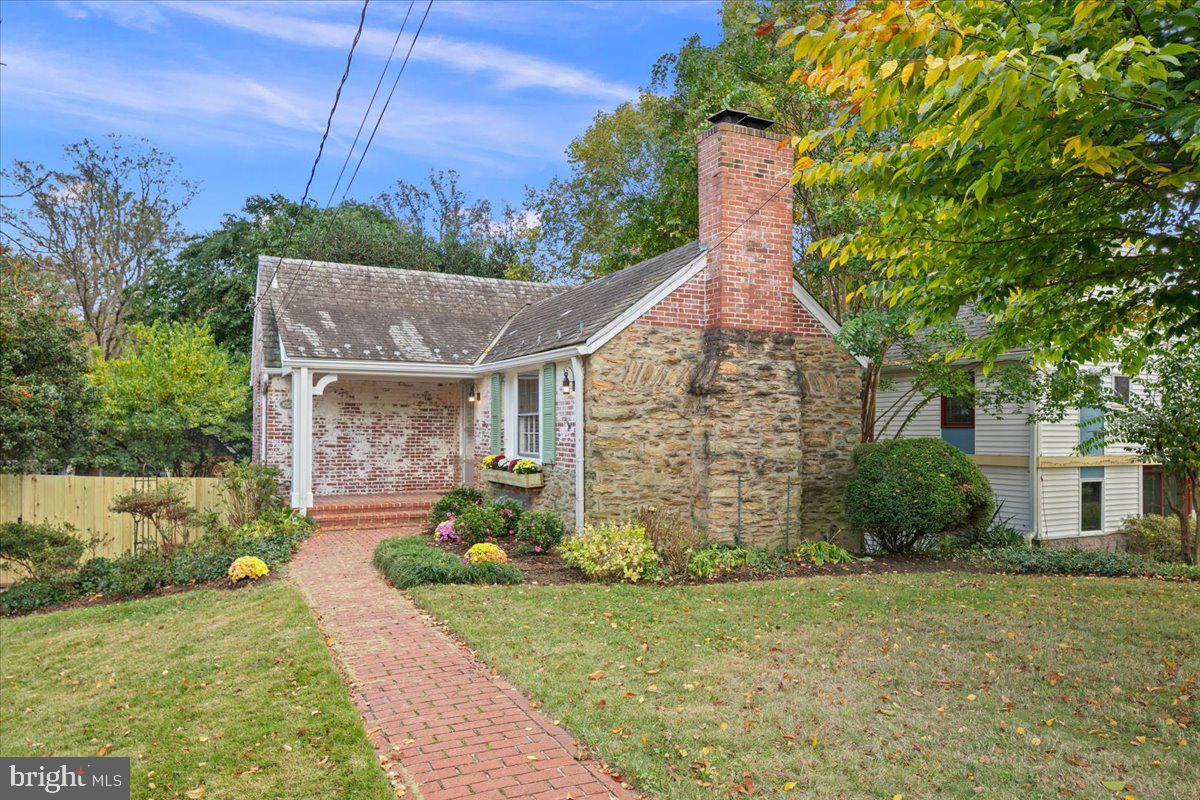 1606 North Springwood Drive Silver Spring, MD 20910 - Photo 3 of 36 a front view of a house with garden
