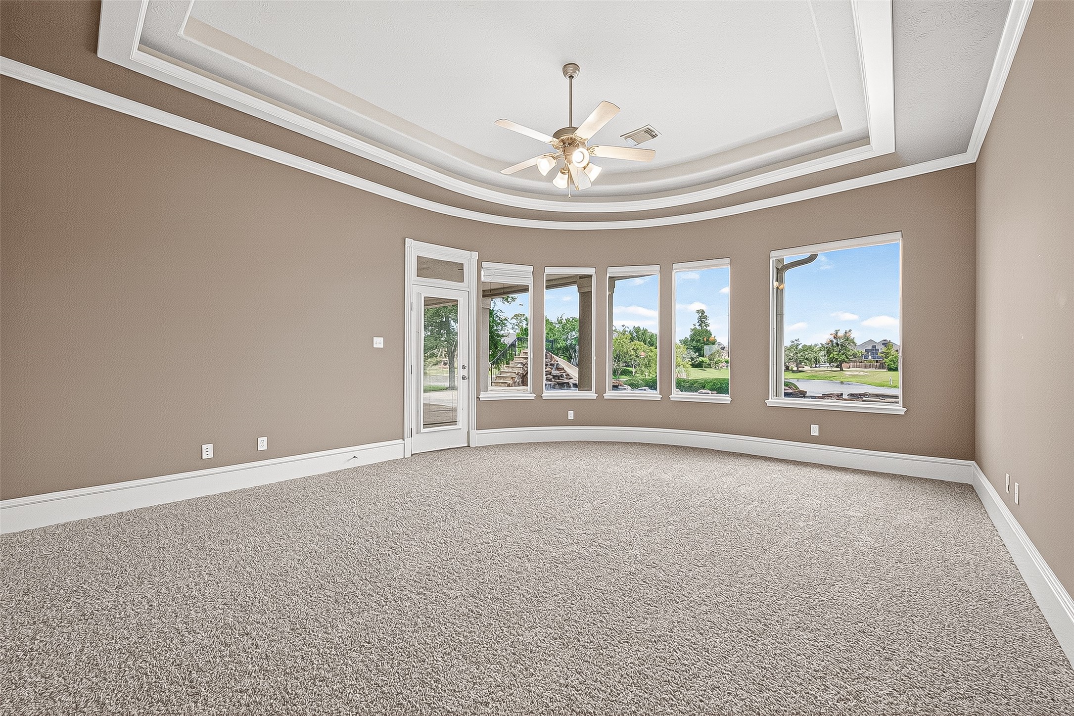 25626 Windy Isle Court Spring, TX 77389 - Photo 17 of 45 Large windows and a glass door provide abundant natural light and picturesque views of the outdoors.