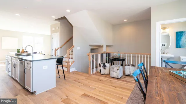 a kitchen view with furniture a counter space and a dining table