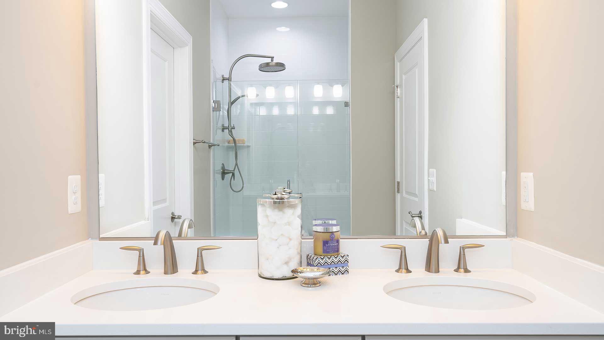 316 Anthem Street Ranson, WV 25438 - Photo 7 of 33 a bathroom with a double vanity sink and a mirror