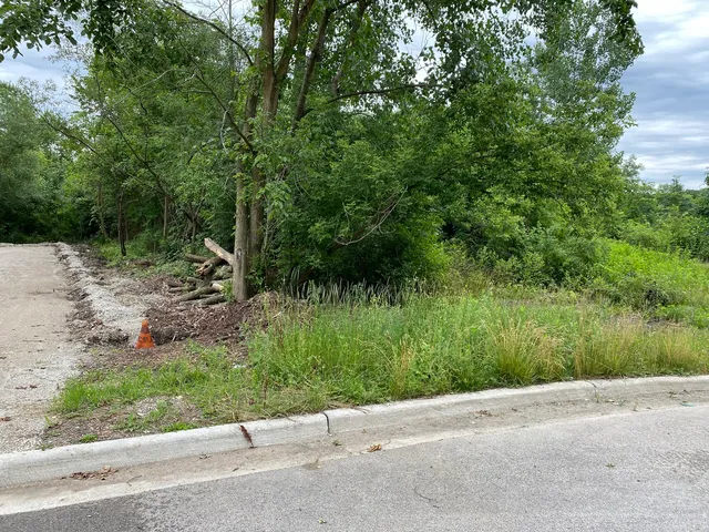 a view of a street both side of a house