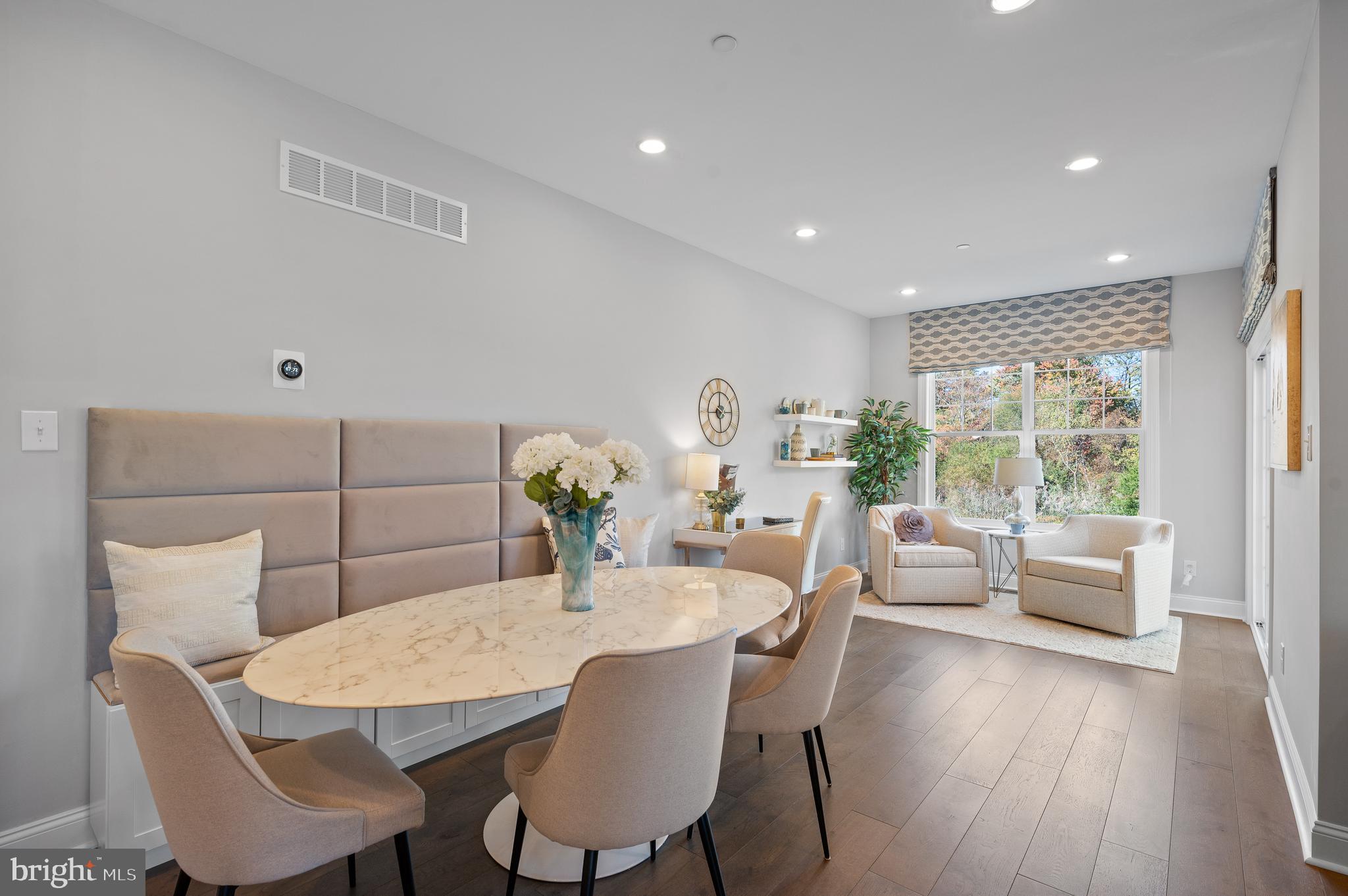 156 Bancroft Road, Unit SUTTON Kennett Square, PA 19348 - Photo 13 of 50 a view of a dining room with furniture window and wooden floor