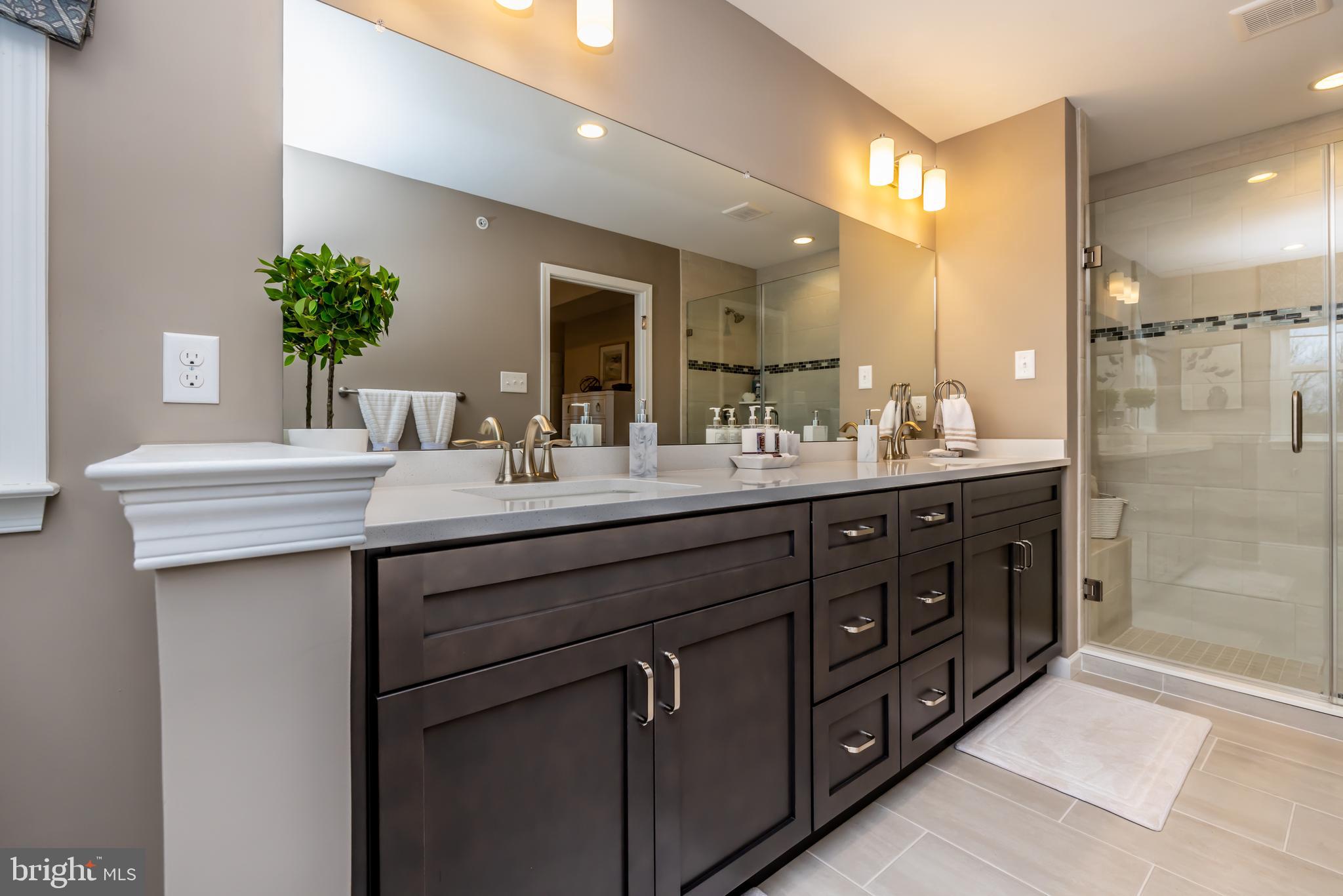 156 Bancroft Road, Unit SUTTON Kennett Square, PA 19348 - Photo 23 of 48 a bathroom with a double vanity sink and a mirror