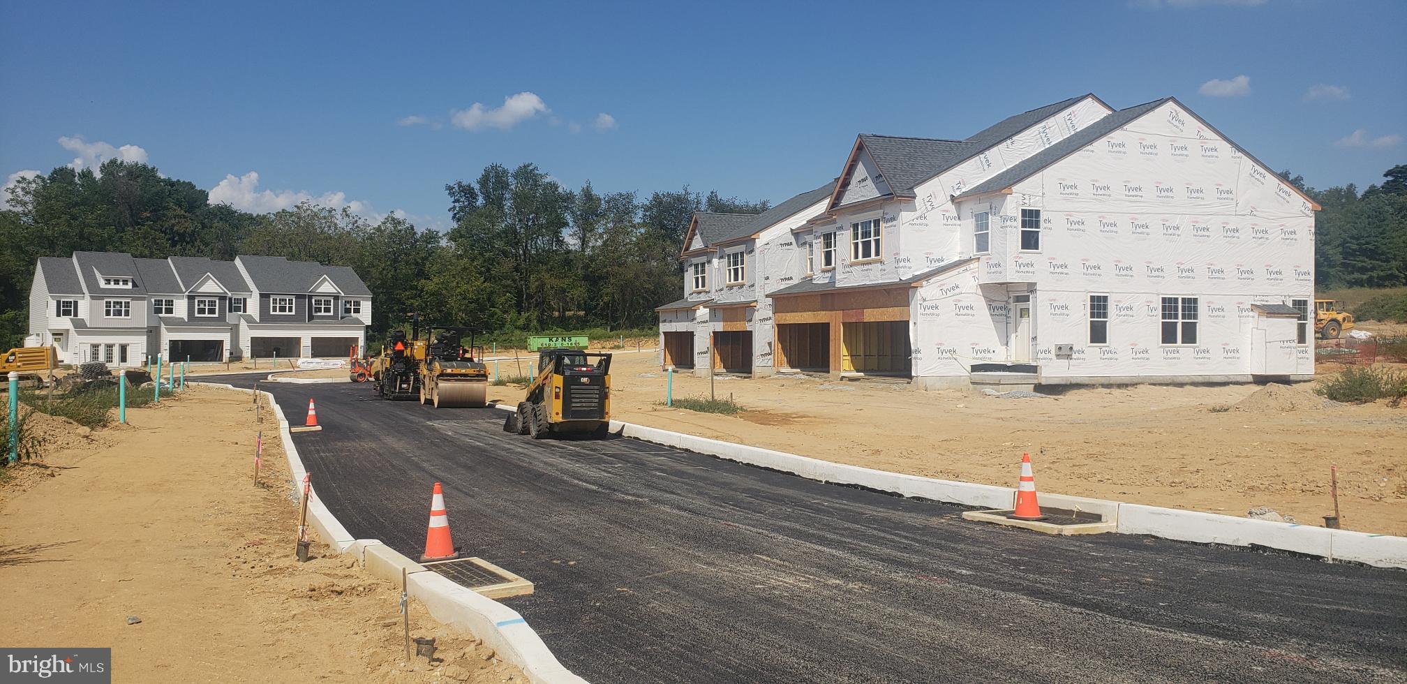 156 Bancroft Road, Unit SUTTON Kennett Square, PA 19348 - Photo 33 of 50 a view of a house with roof and sitting area