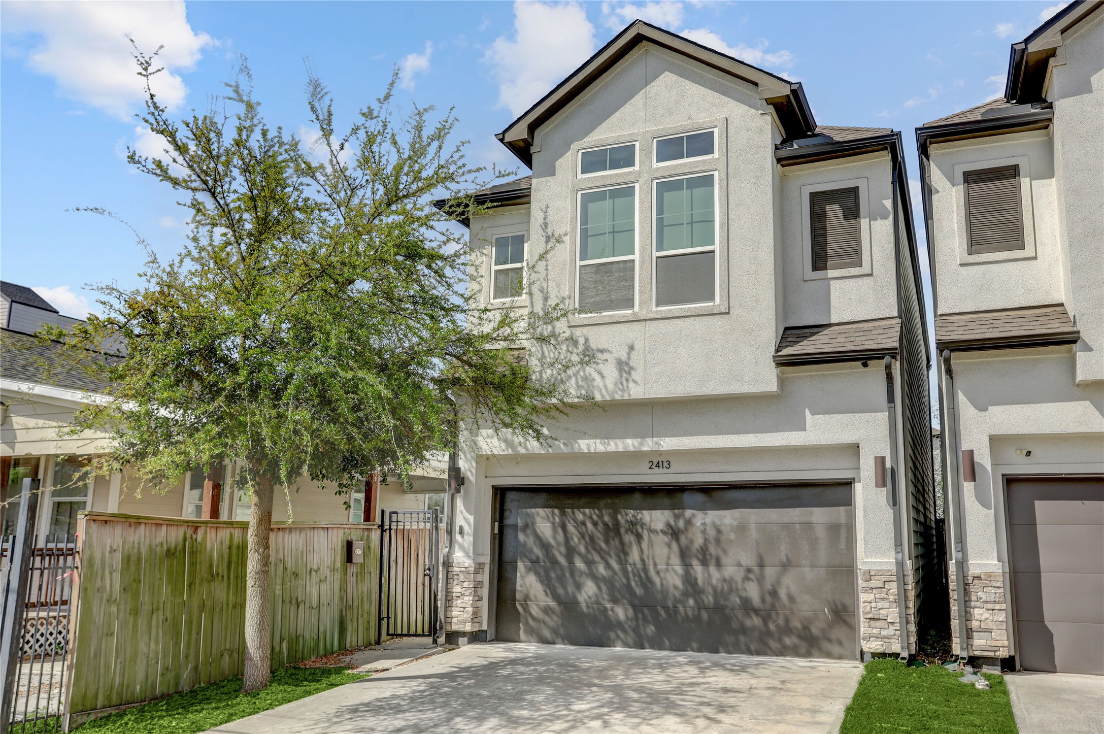 2413 Chapman Street Houston, TX 77009 - Photo 1 of 18 a front view of a house with a garden
