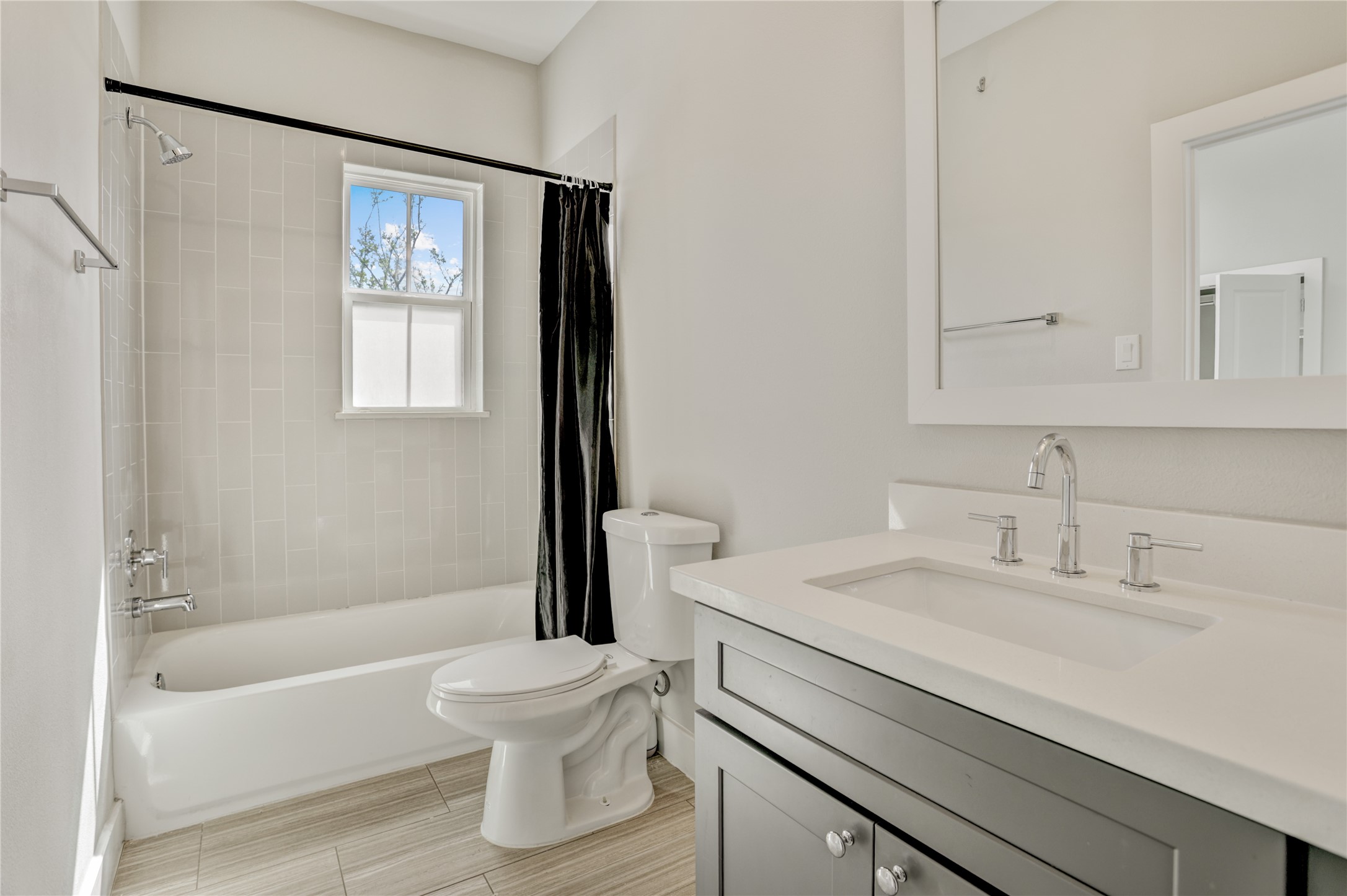 2413 Chapman Street Houston, TX 77009 - Photo 13 of 18 a bathroom with a sink a toilet and a bathtub