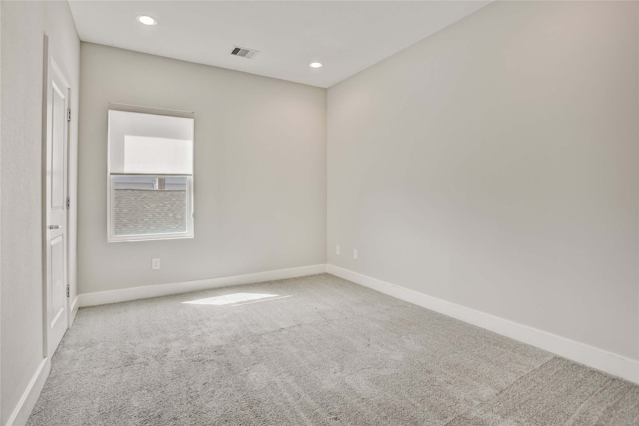 2413 Chapman Street Houston, TX 77009 - Photo 14 of 18 a view of an empty room with a window