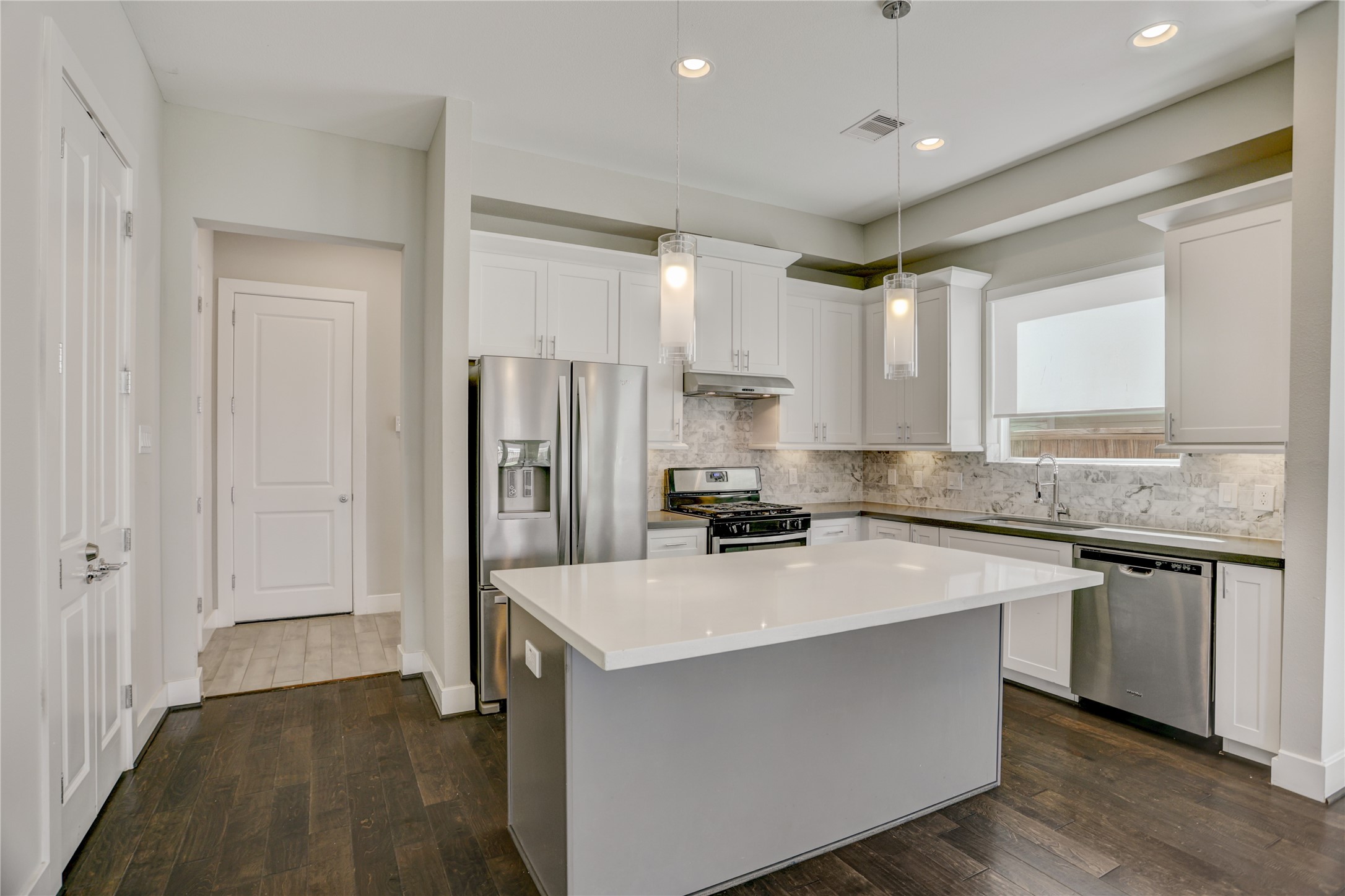 2413 Chapman Street Houston, TX 77009 - Photo 4 of 18 a kitchen with stainless steel appliances a sink stove and refrigerator