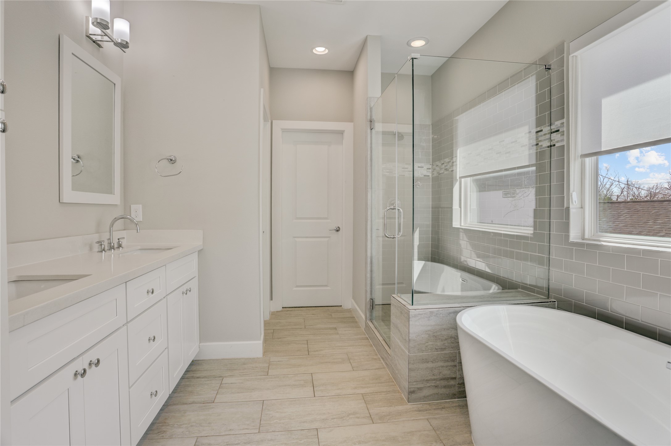 2413 Chapman Street Houston, TX 77009 - Photo 9 of 18 a spacious bathroom with a tub sink shower and mirror