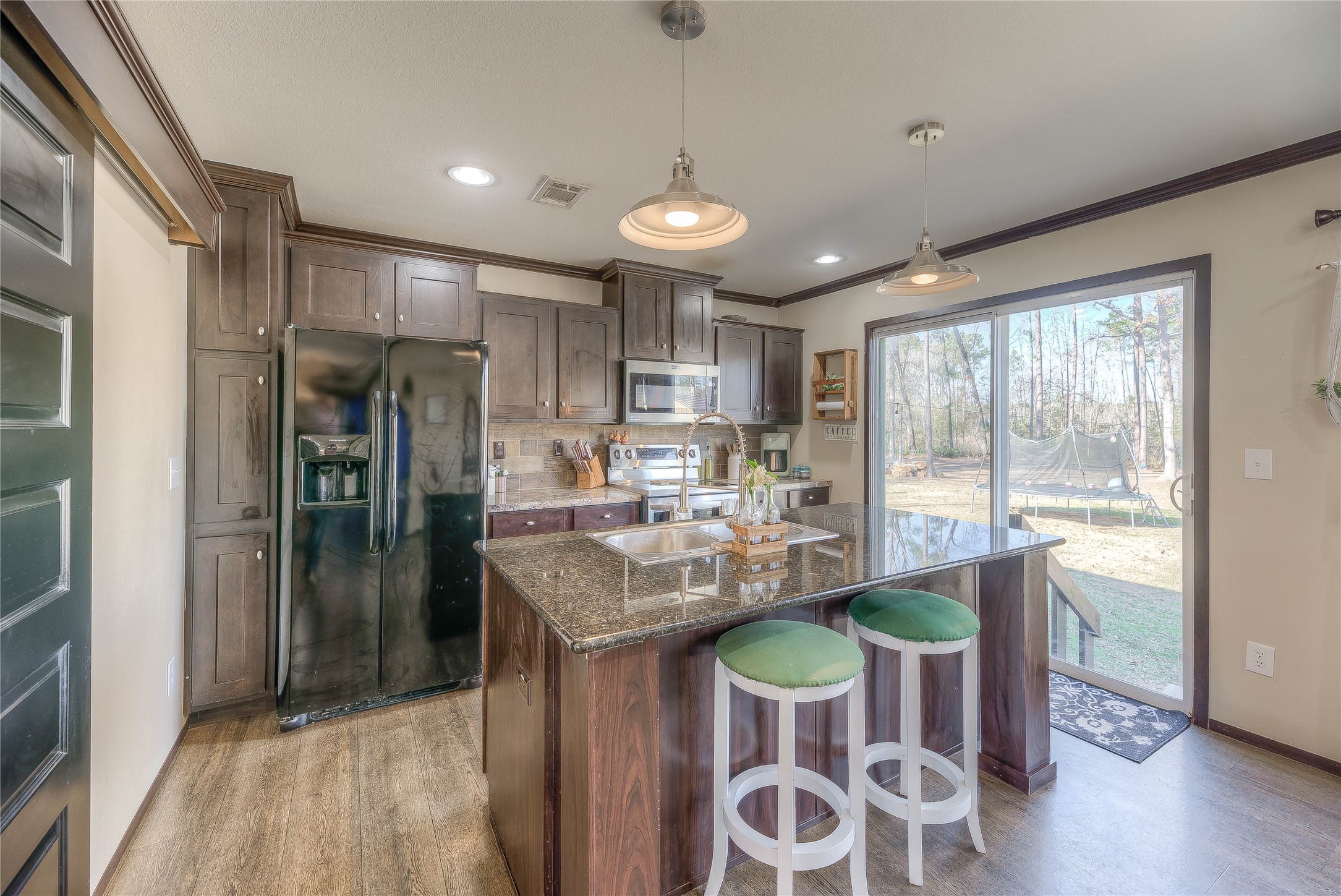 2757 East Capps Road Livingston, TX 77351 - Photo 8 of 42 Sidling door with access to the backyard.