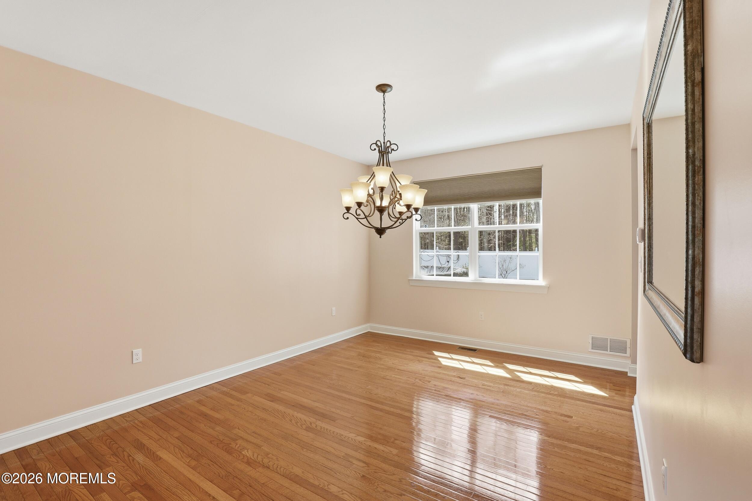 4 Firenze Road Jackson, NJ 08527 - Photo 11 of 57 a view of empty room with wooden floor and fan