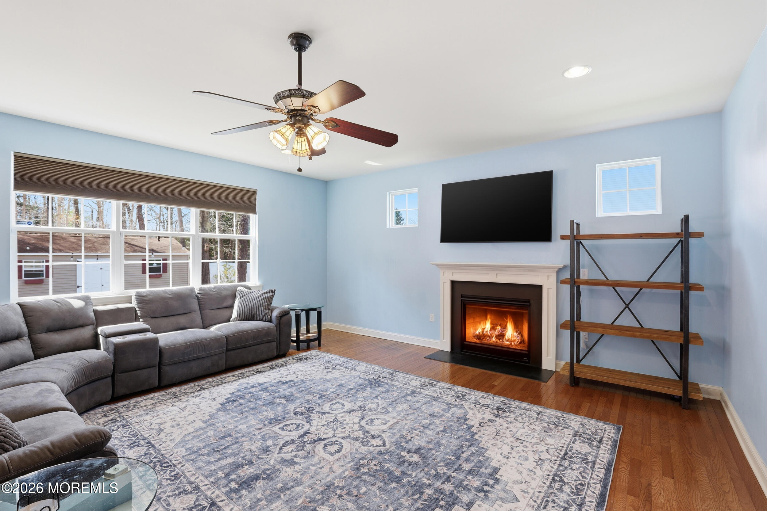 4 Firenze Road Jackson, NJ 08527 - Photo 15 of 57 a living room with furniture a fireplace and a flat screen tv