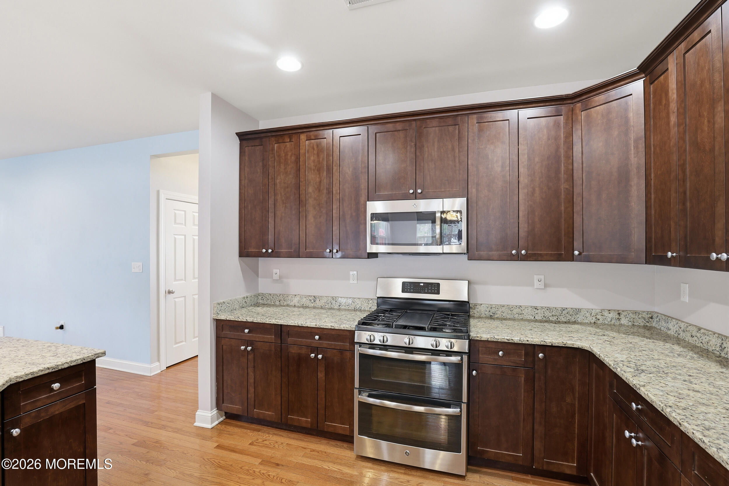 4 Firenze Road Jackson, NJ 08527 - Photo 19 of 57 a kitchen with granite countertop wooden cabinets and stainless steel appliances