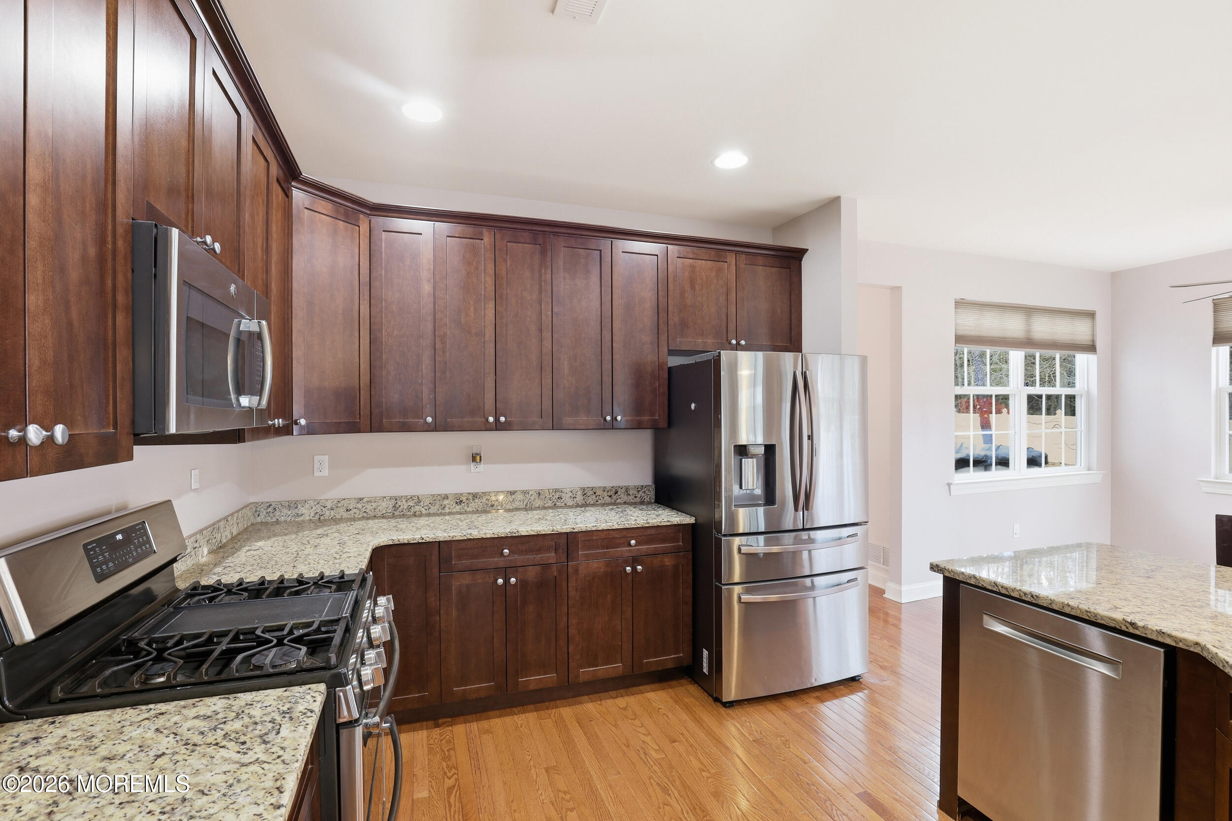 4 Firenze Road Jackson, NJ 08527 - Photo 20 of 57 a kitchen with granite countertop stainless steel appliances and wooden cabinets