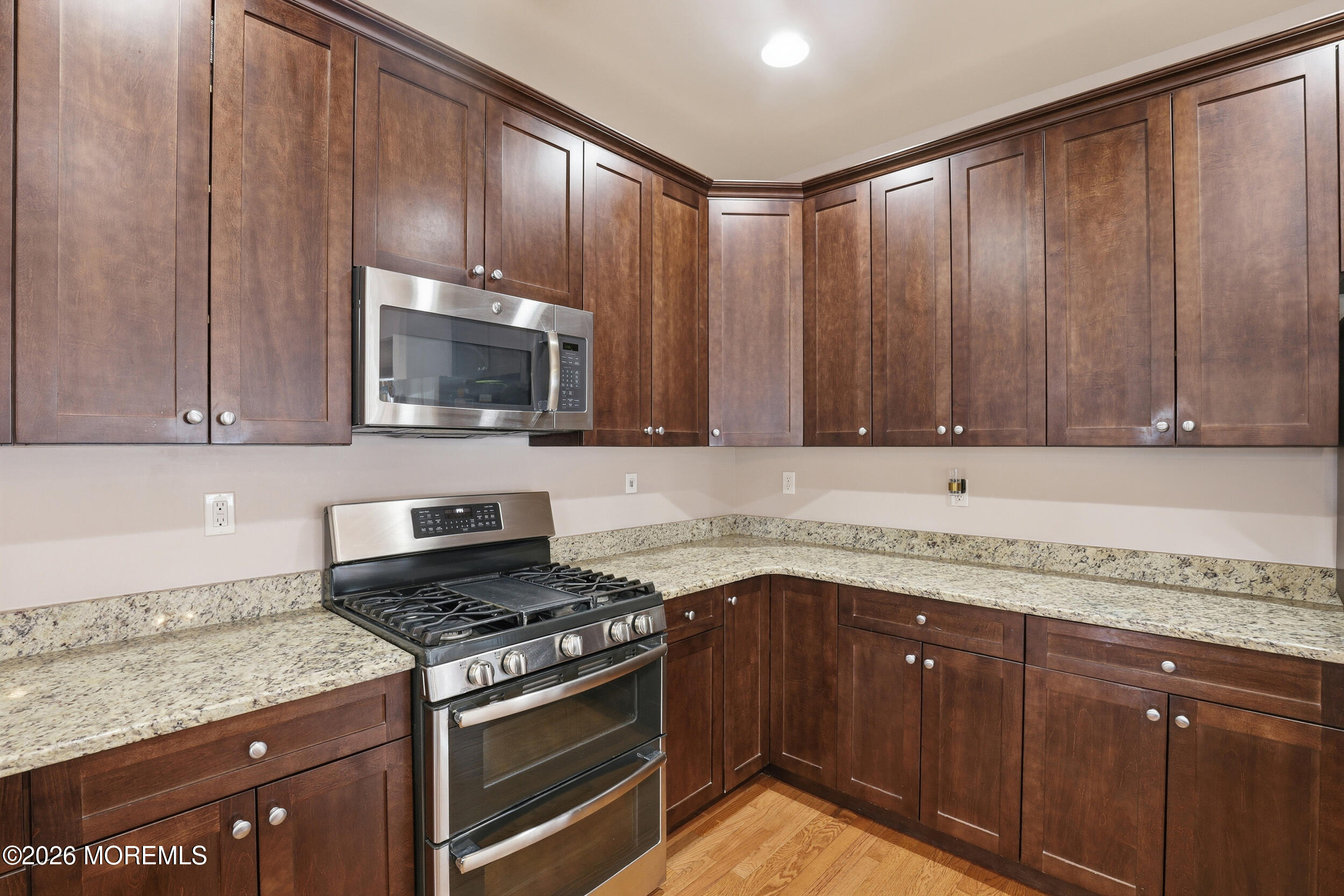 4 Firenze Road Jackson, NJ 08527 - Photo 21 of 57 a kitchen with granite countertop cabinets stainless steel appliances and a sink