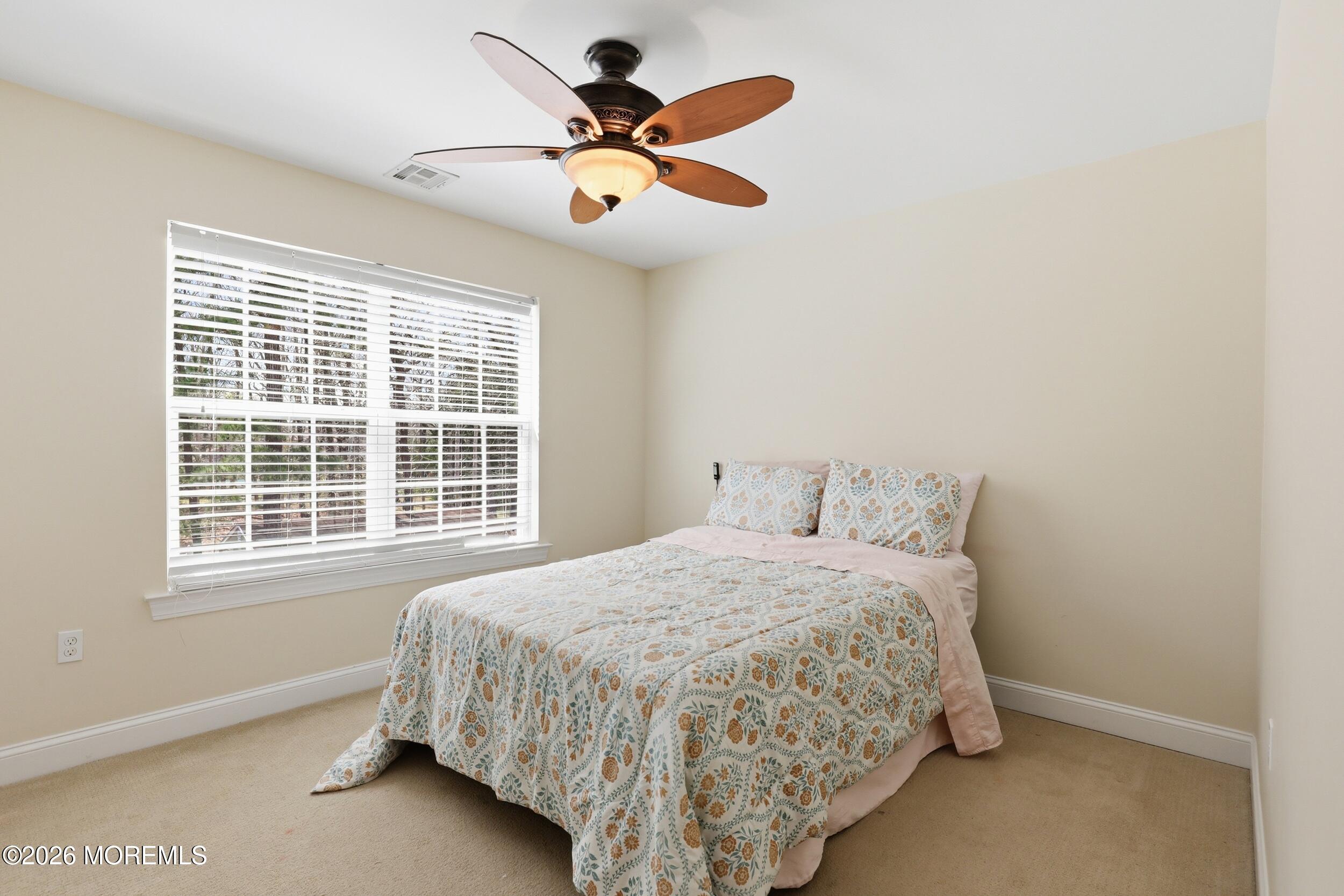 4 Firenze Road Jackson, NJ 08527 - Photo 31 of 57 a bedroom with a bed and a large window