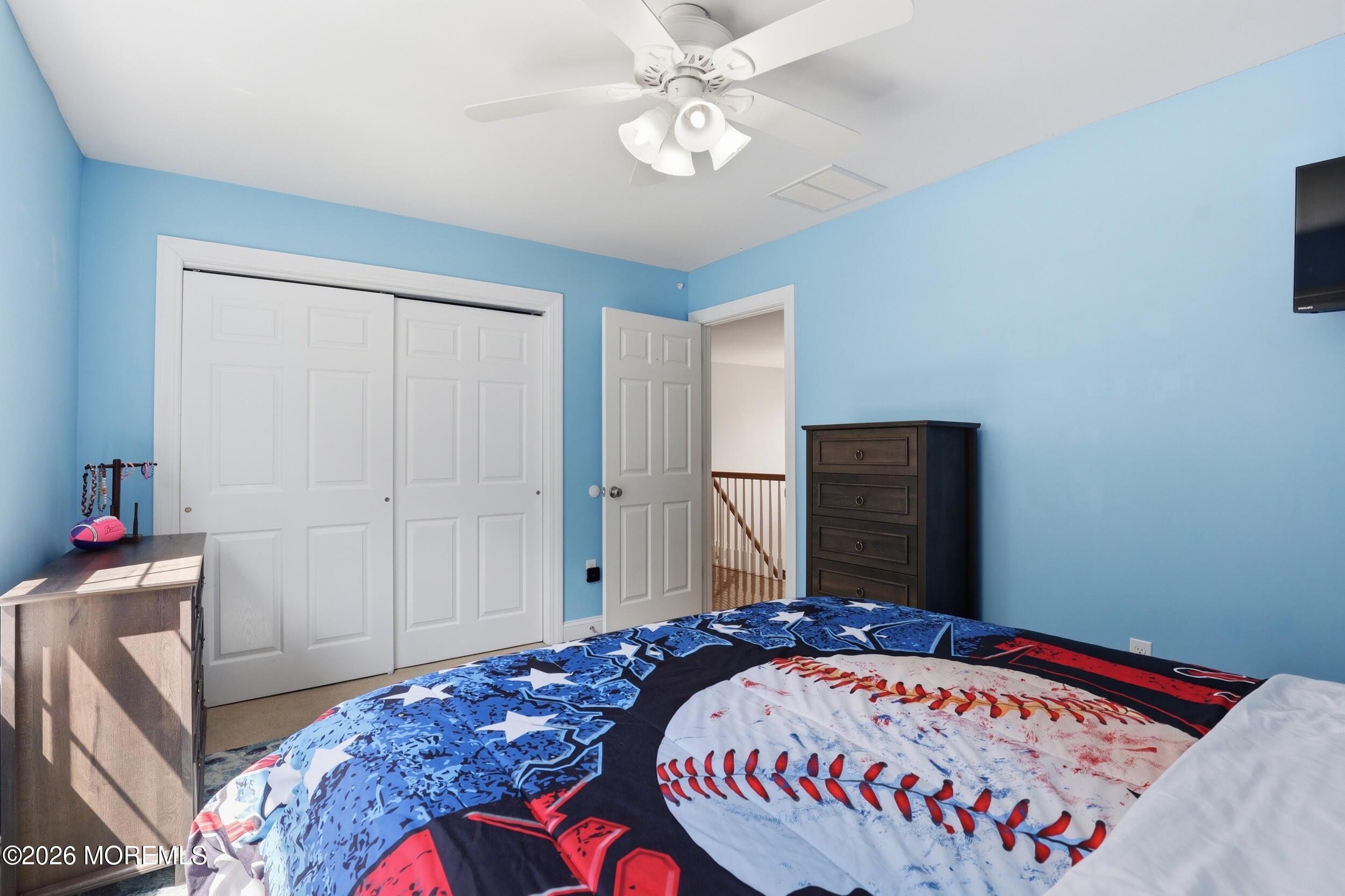 4 Firenze Road Jackson, NJ 08527 - Photo 34 of 57 a bedroom with a bed and a chandelier