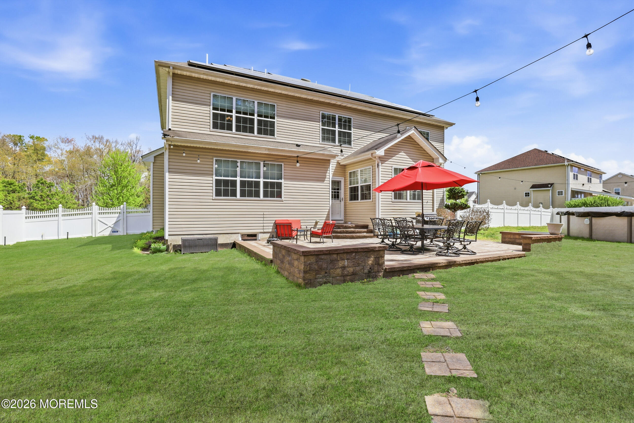 4 Firenze Road Jackson, NJ 08527 - Photo 41 of 57 a front view of house with yard and outdoor seating