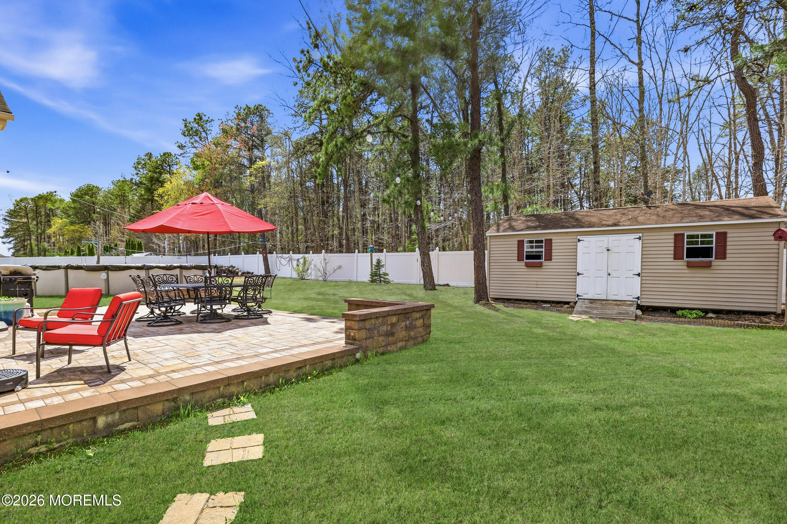 4 Firenze Road Jackson, NJ 08527 - Photo 43 of 57 a view of a house with backyard sitting area and garden