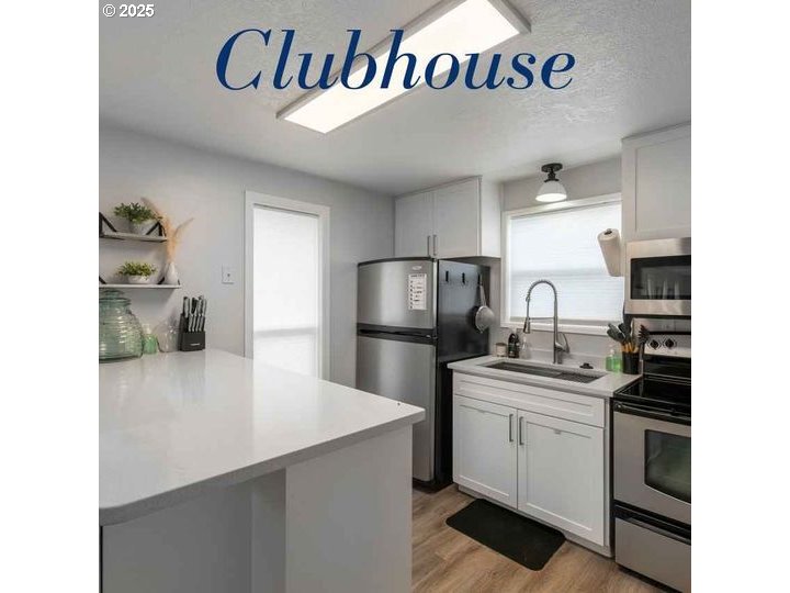 5510 Windsor Island Road North Keizer, OR 97303 - Photo 13 of 35 a kitchen with a sink and a refrigerator