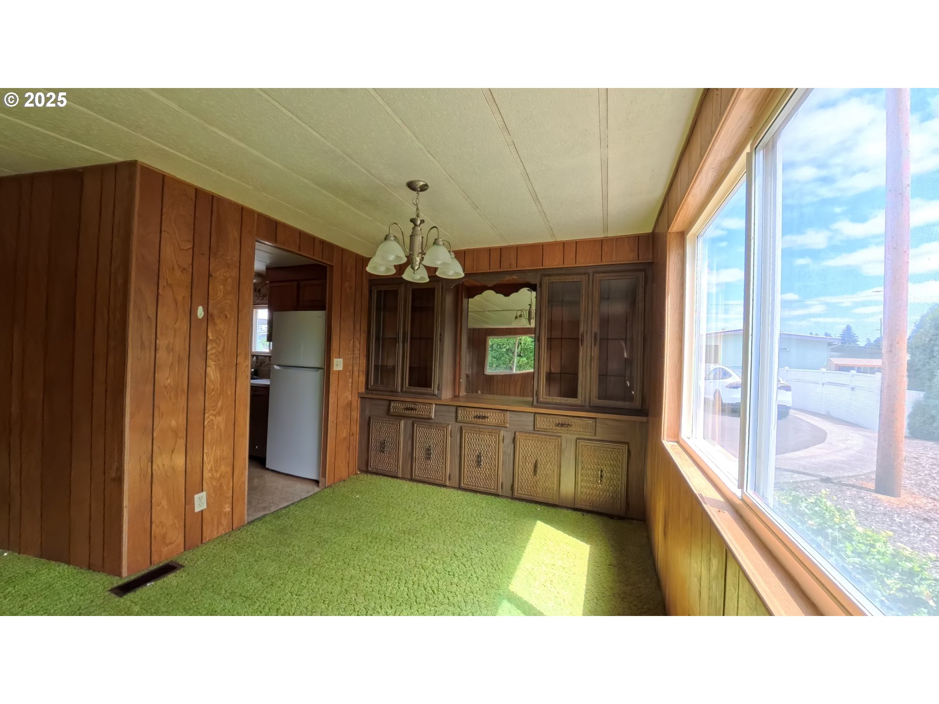 5510 Windsor Island Road North Keizer, OR 97303 - Photo 18 of 35 a open kitchen with kitchen island stainless steel appliances sink and refrigerator